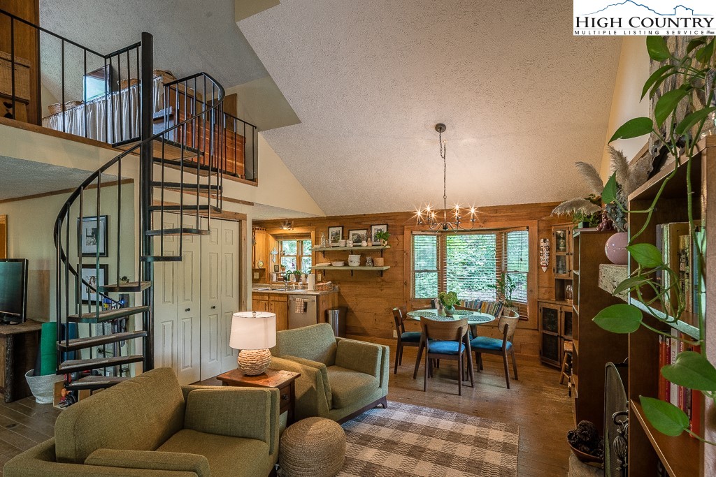 166 Mountain Ivy Lane Boone, NC 28607 - Photo 4 of 23 a living room with furniture a lamp and a potted plant