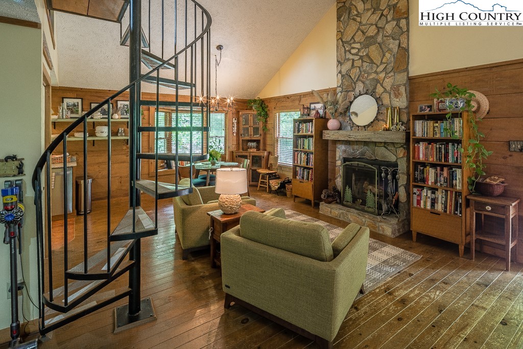 166 Mountain Ivy Lane Boone, NC 28607 - Photo 5 of 23 a living room with furniture a rug and a fireplace