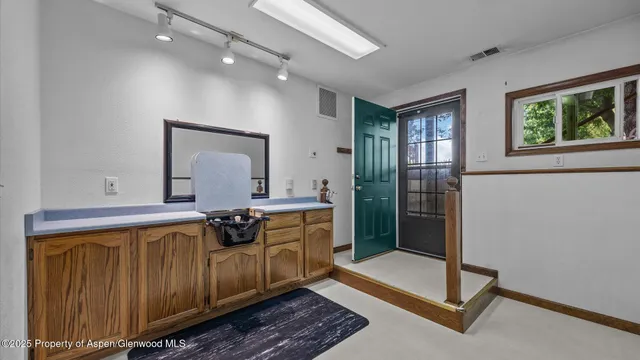 a view of a hallway with front door
