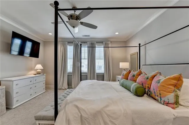 a bedroom with a bed and a walk in closet