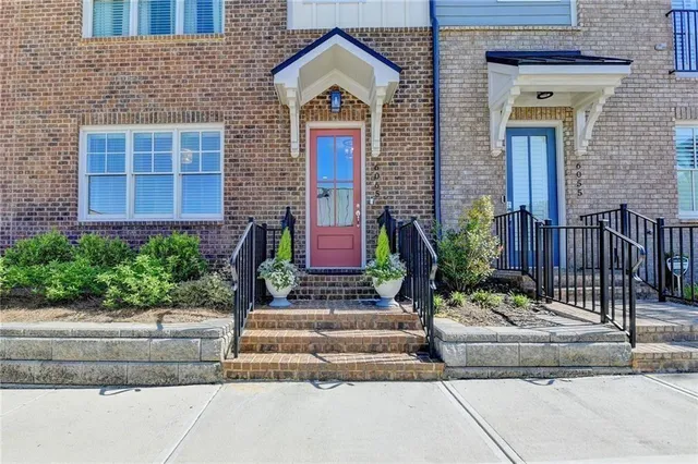 a front view of a house with garden