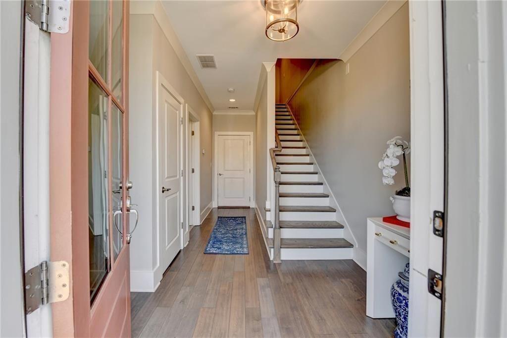 6065 Cushing Circle Norcross, GA 30071 - Photo 4 of 44 a view of a hallway with wooden floor and entryway