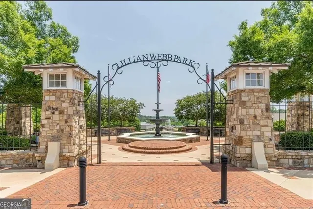a swimming pool with outdoor seating and yard