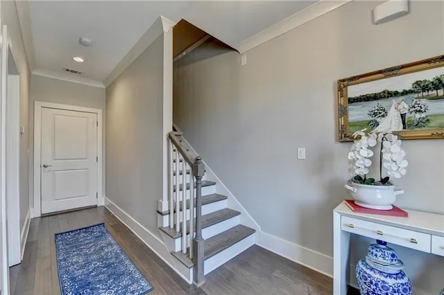 a view of an entryway with wooden floor