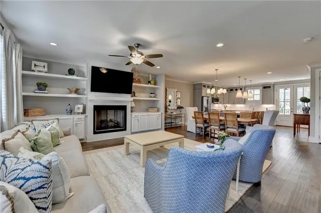 a living room with furniture fireplace and flat screen tv
