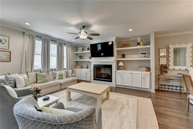 a living room with furniture fireplace and flat screen tv