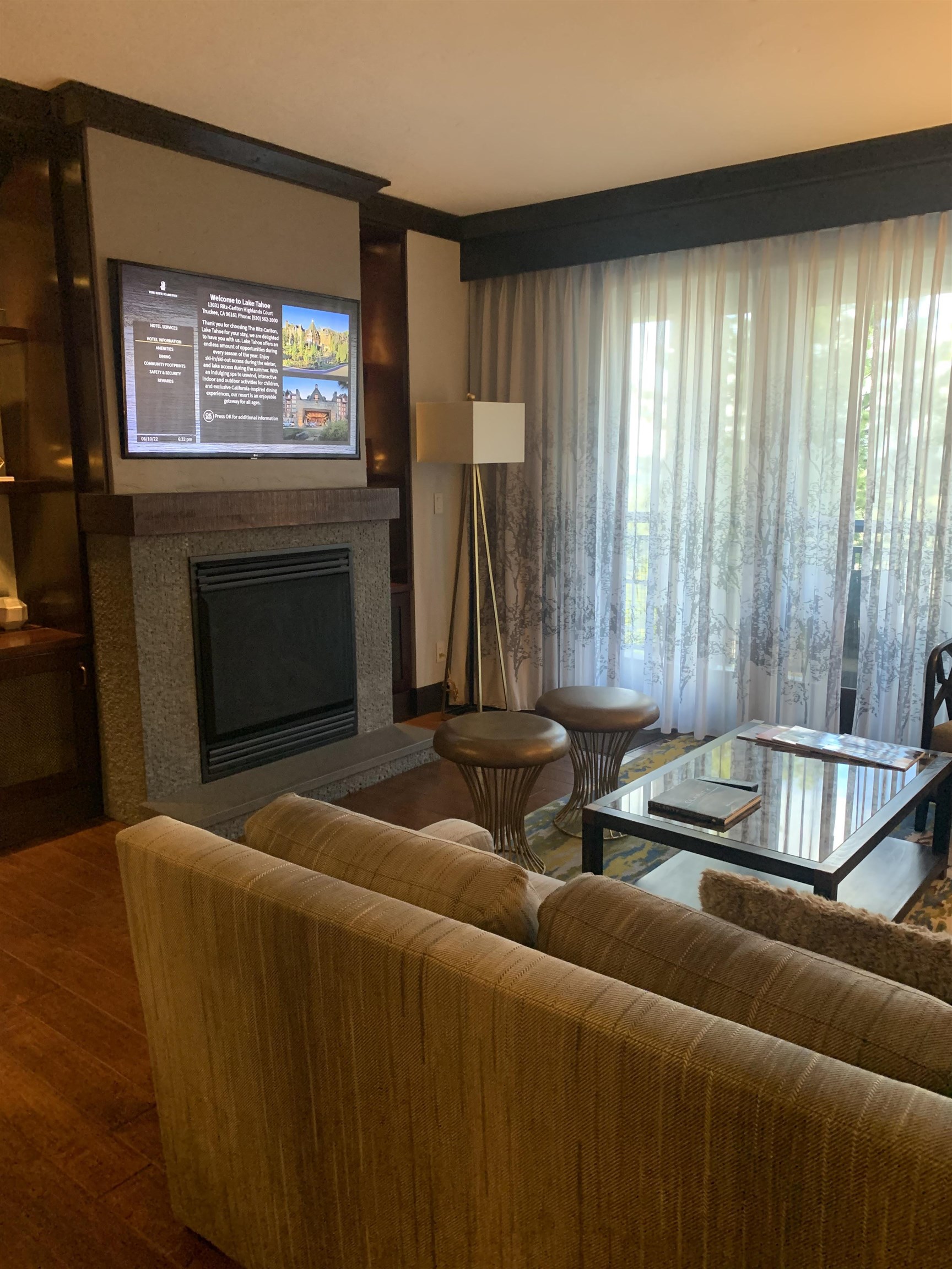 13051 Ritz Carlton Highlands Court, Unit 4303 INTEREST 3 Truckee, CA 96161 - Photo 3 of 8 a living room with furniture and a fireplace