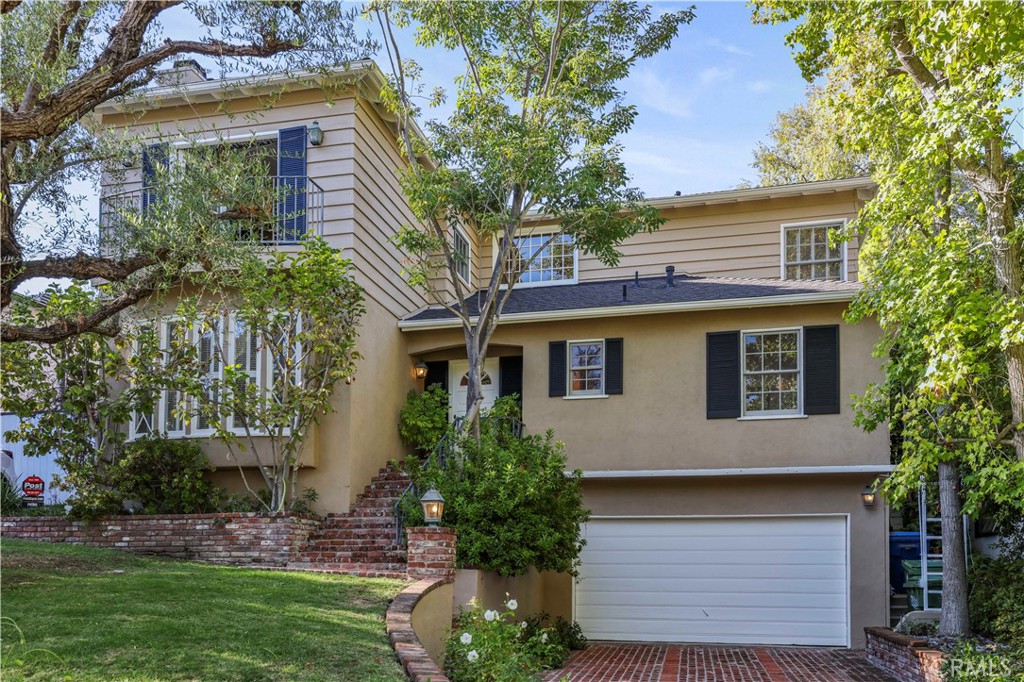 14015 Roblar Road Sherman Oaks, CA 91423 - Photo 1 of 35 a front view of a house with a garden