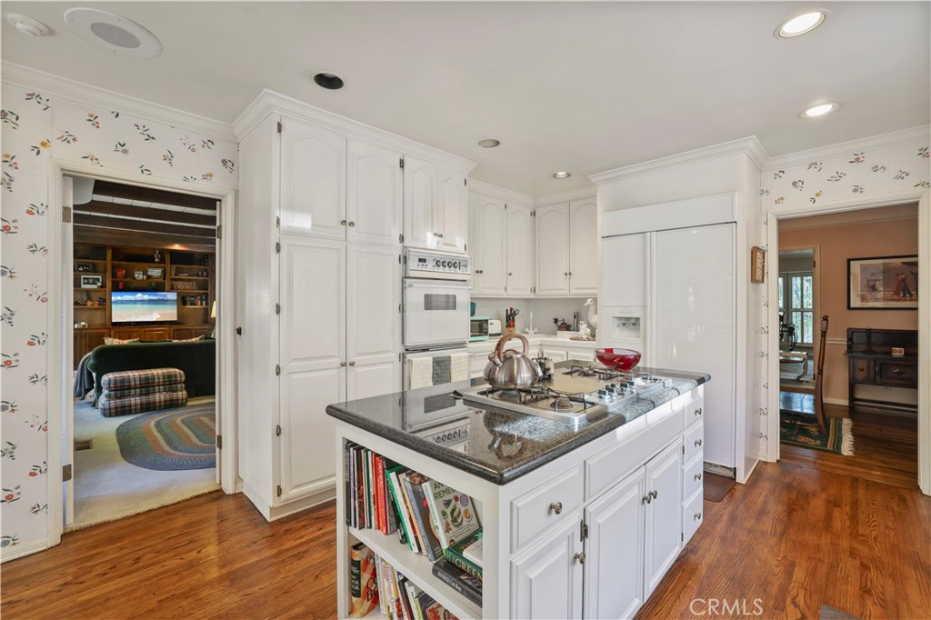 14015 Roblar Road Sherman Oaks, CA 91423 - Photo 11 of 35 a kitchen with stainless steel appliances granite countertop a stove and a refrigerator