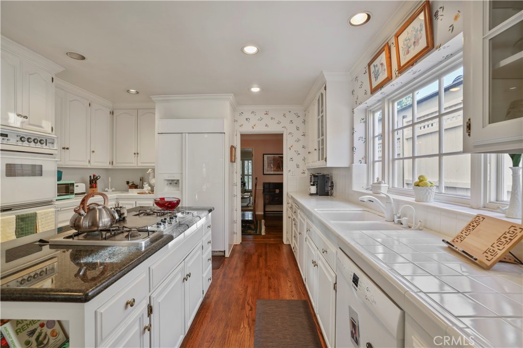 14015 Roblar Road Sherman Oaks, CA 91423 - Photo 12 of 35 a open kitchen with stainless steel appliances granite countertop a sink stove and refrigerator