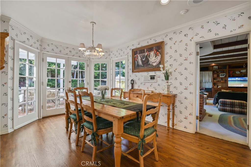 14015 Roblar Road Sherman Oaks, CA 91423 - Photo 13 of 35 a view of a dining room with furniture window and wooden floor