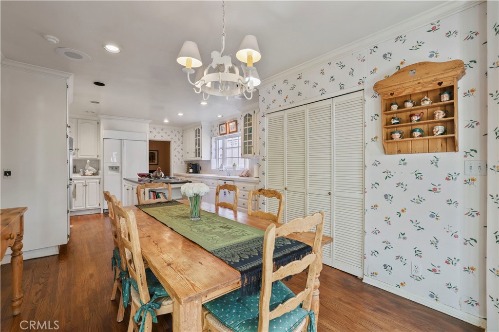 14015 Roblar Road Sherman Oaks, CA 91423 - Photo 14 of 35 a dining room filled chandelier and wooden floor
