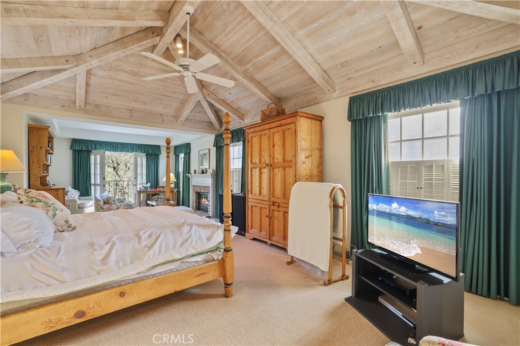 14015 Roblar Road Sherman Oaks, CA 91423 - Photo 15 of 35 a bedroom with a bed next to a window