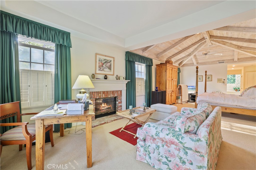 14015 Roblar Road Sherman Oaks, CA 91423 - Photo 17 of 35 a living room with fireplace furniture and a fireplace