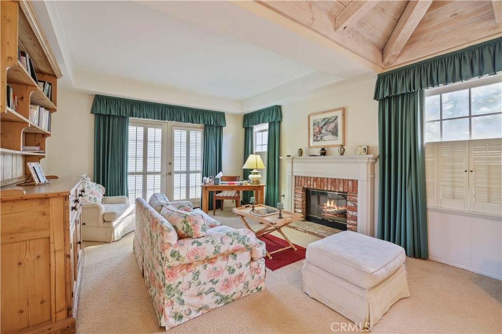 14015 Roblar Road Sherman Oaks, CA 91423 - Photo 18 of 35 a living room with furniture and a fireplace