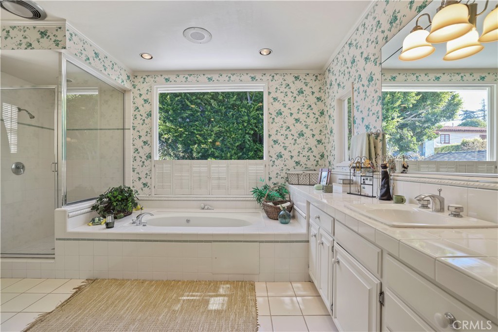 14015 Roblar Road Sherman Oaks, CA 91423 - Photo 21 of 35 a bathroom with a bathtub a sink and a window