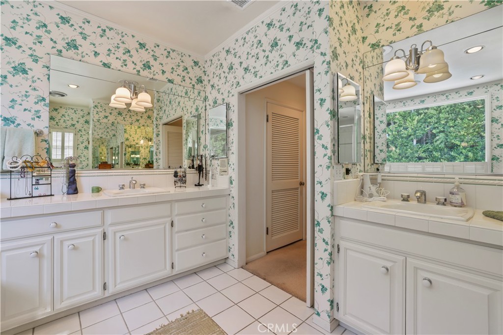 14015 Roblar Road Sherman Oaks, CA 91423 - Photo 22 of 35 a spacious bathroom with a double vanity sink mirror and shower