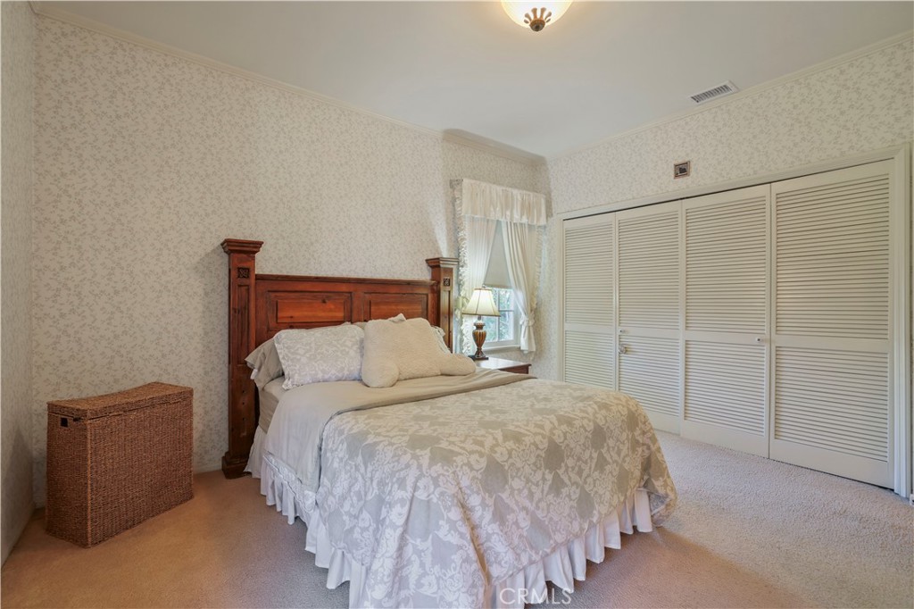 14015 Roblar Road Sherman Oaks, CA 91423 - Photo 26 of 35 a bedroom with a bed and a closet