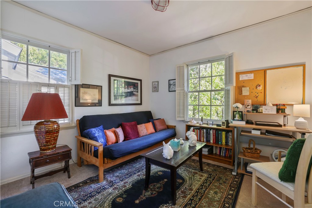 14015 Roblar Road Sherman Oaks, CA 91423 - Photo 27 of 35 a living room with furniture and a window