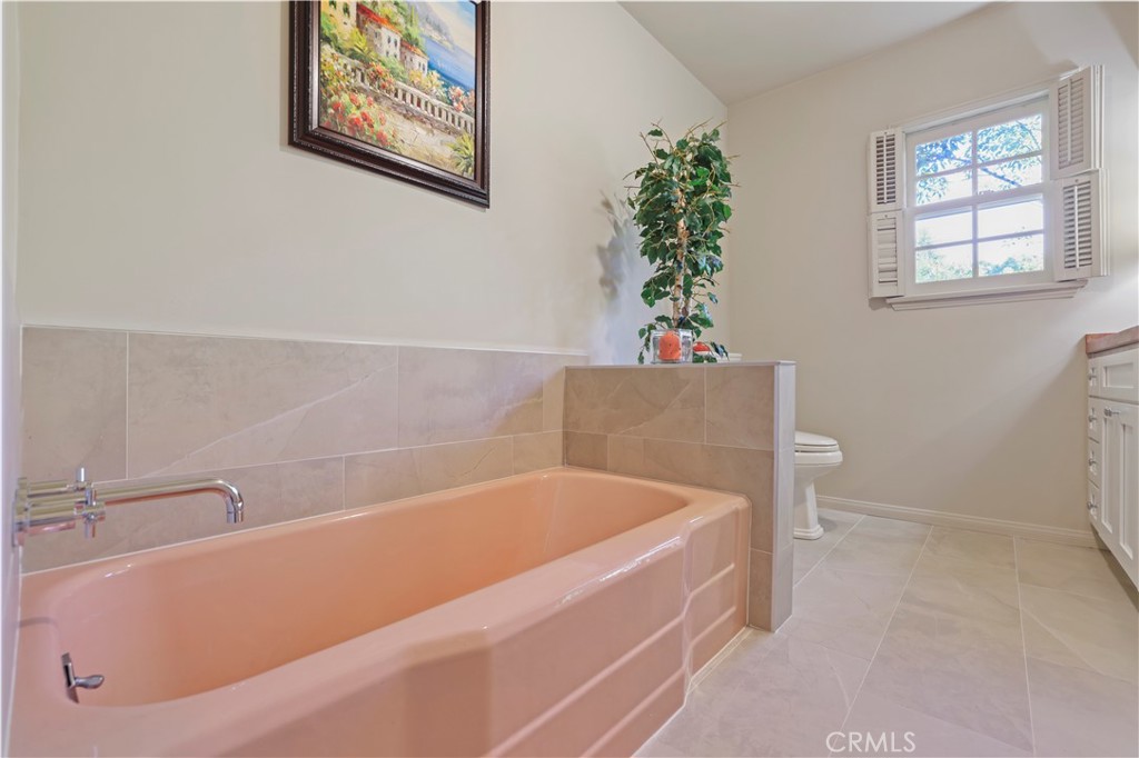 14015 Roblar Road Sherman Oaks, CA 91423 - Photo 28 of 35 a bathroom with a tub and a potted plant