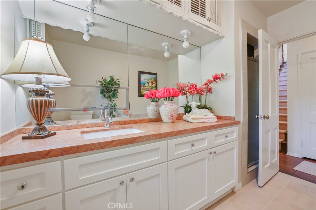 14015 Roblar Road Sherman Oaks, CA 91423 - Photo 29 of 35 a bathroom with a sink and a mirror