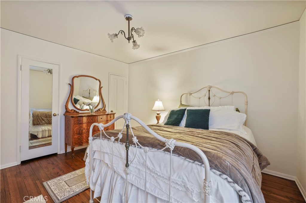 14015 Roblar Road Sherman Oaks, CA 91423 - Photo 30 of 35 a bedroom with a bed and wooden floor