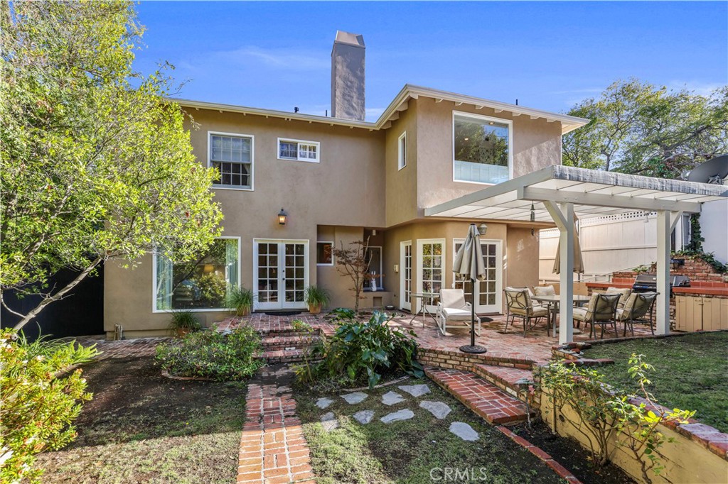 14015 Roblar Road Sherman Oaks, CA 91423 - Photo 32 of 35 a front view of a house with garden