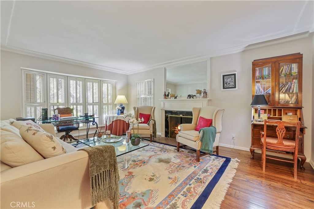 14015 Roblar Road Sherman Oaks, CA 91423 - Photo 5 of 35 a living room with furniture a fireplace and a window