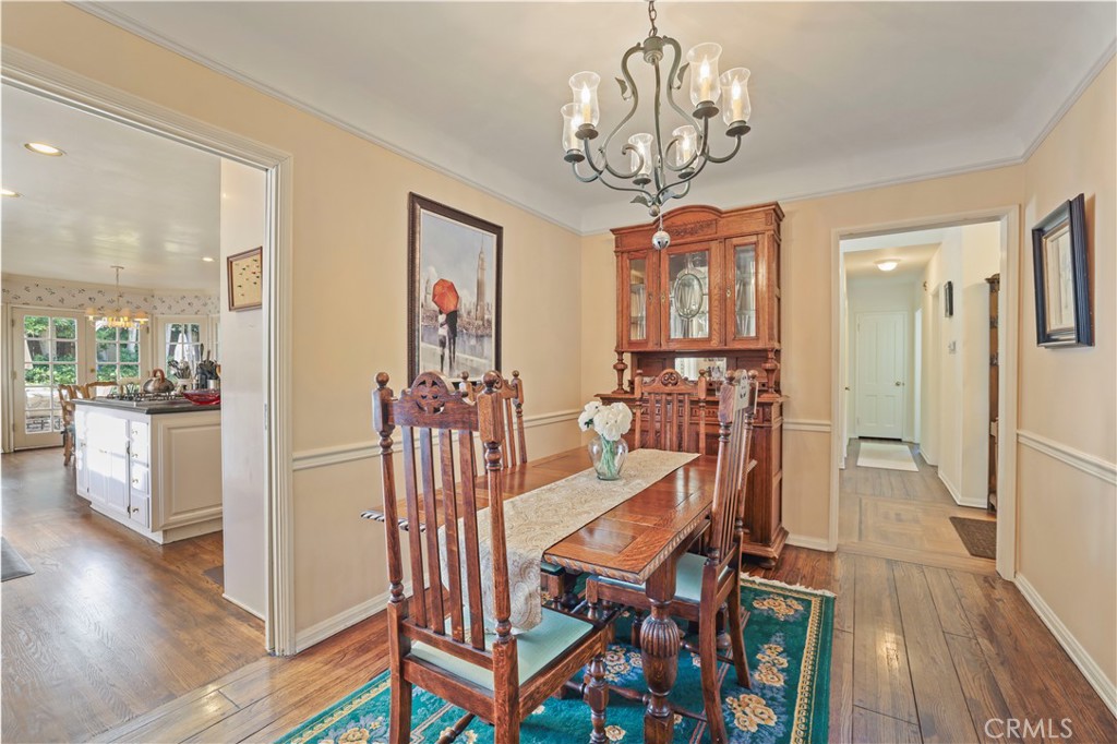 14015 Roblar Road Sherman Oaks, CA 91423 - Photo 6 of 35 a view of a dining room with furniture wooden floor and chandelier