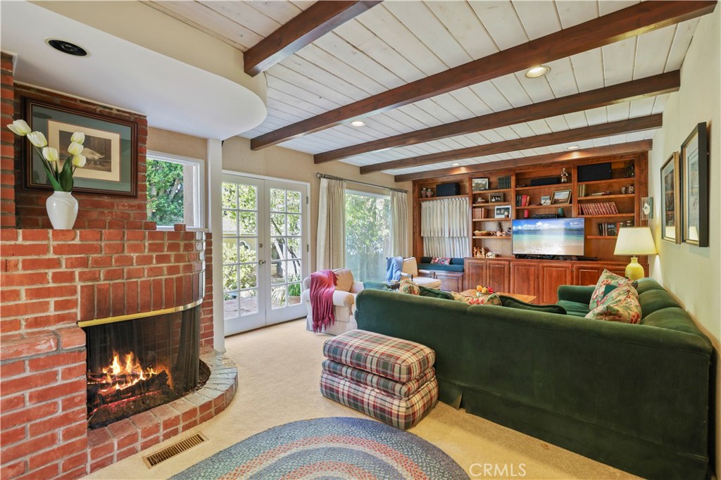 14015 Roblar Road Sherman Oaks, CA 91423 - Photo 7 of 35 a living room with furniture and a fireplace