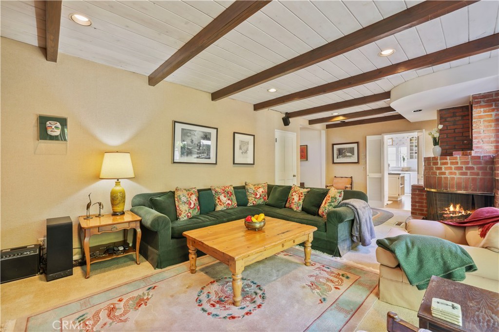 14015 Roblar Road Sherman Oaks, CA 91423 - Photo 8 of 35 a living room with furniture a rug and a table