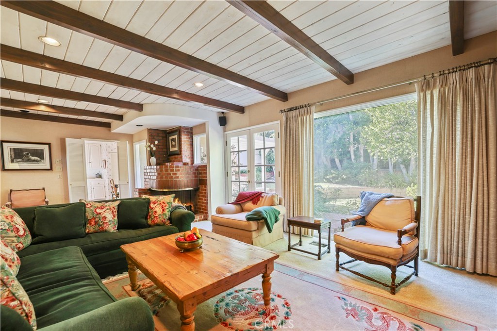 14015 Roblar Road Sherman Oaks, CA 91423 - Photo 9 of 35 a living room with furniture and a large window