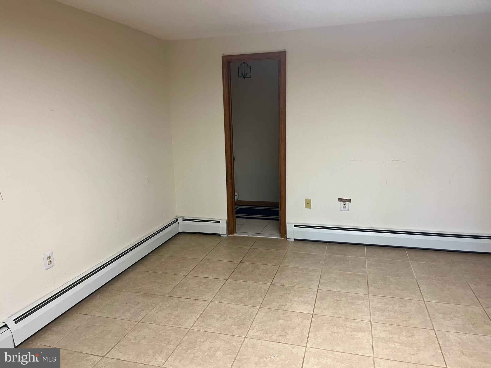 8816 Ridge Avenue, Unit 23 Philadelphia, PA 19128 - Photo 31 of 41 Walk-Out Basement Area with Half Bath
