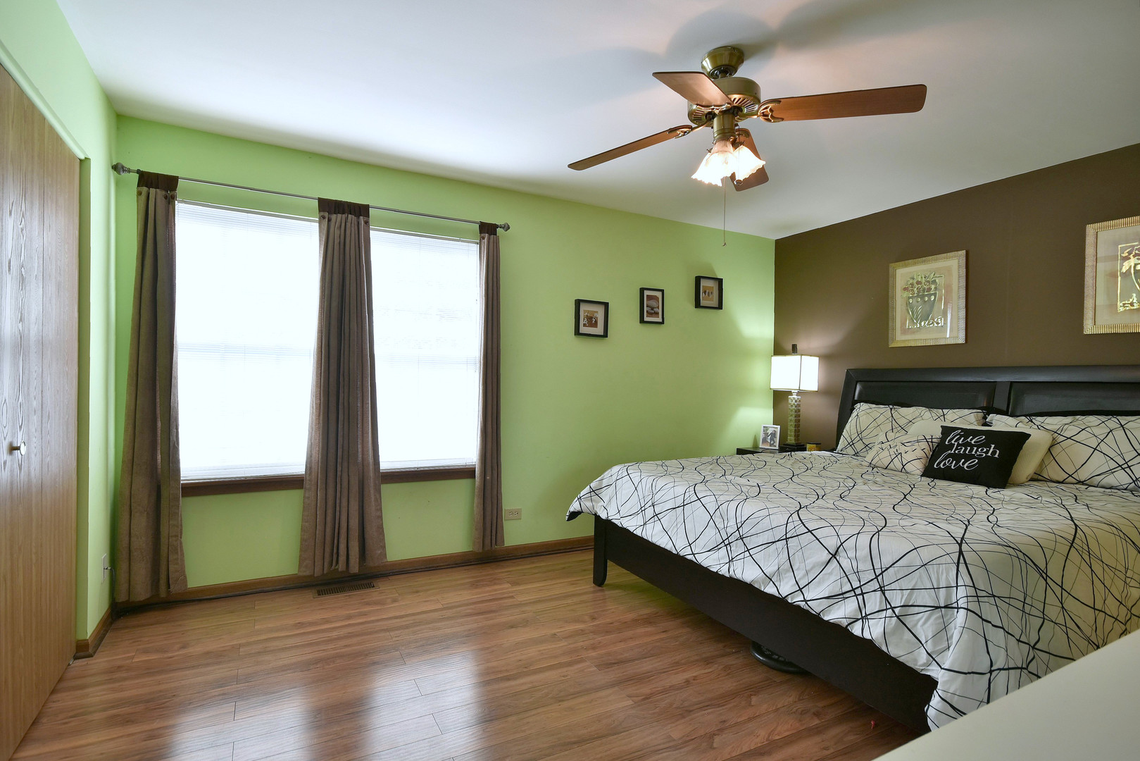 210 Shadybrook Lane Aurora, IL 60504 - Photo 17 of 26 a bedroom with a bed and a chandelier