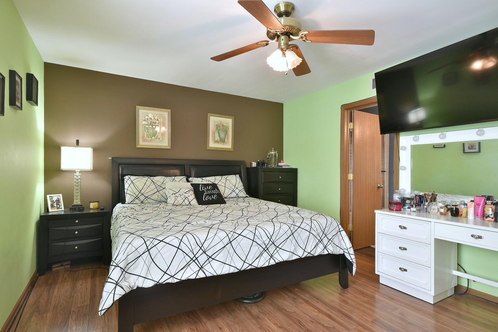 210 Shadybrook Lane Aurora, IL 60504 - Photo 18 of 26 a bedroom with a bed and a flat screen tv