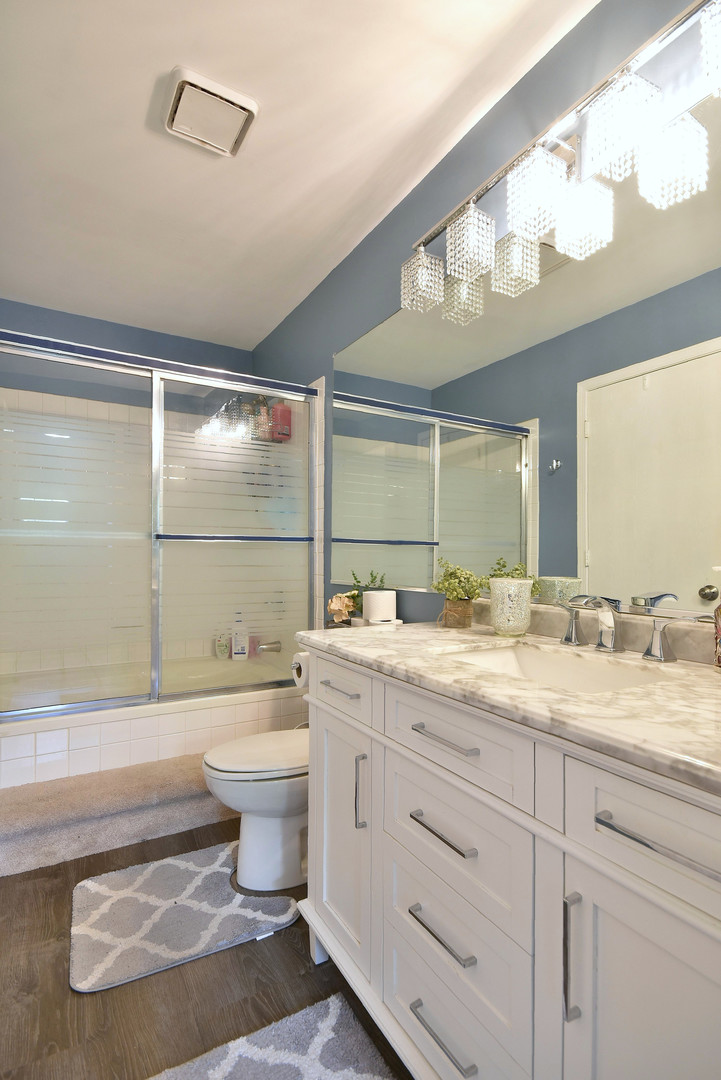 210 Shadybrook Lane Aurora, IL 60504 - Photo 20 of 26 a bathroom with a granite countertop sink mirror vanity and toilet