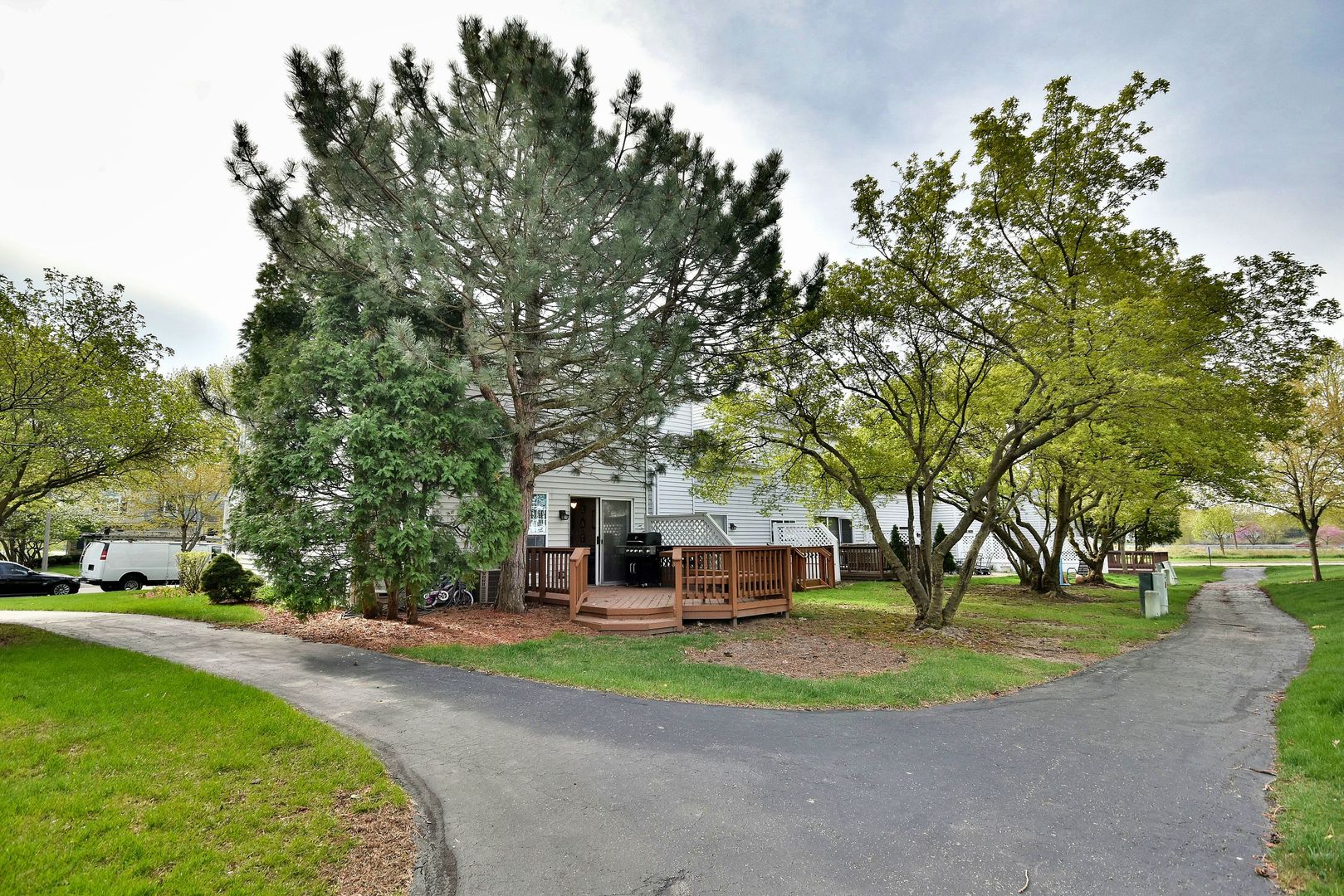 210 Shadybrook Lane Aurora, IL 60504 - Photo 26 of 26 a front view of a house with a yard and large trees