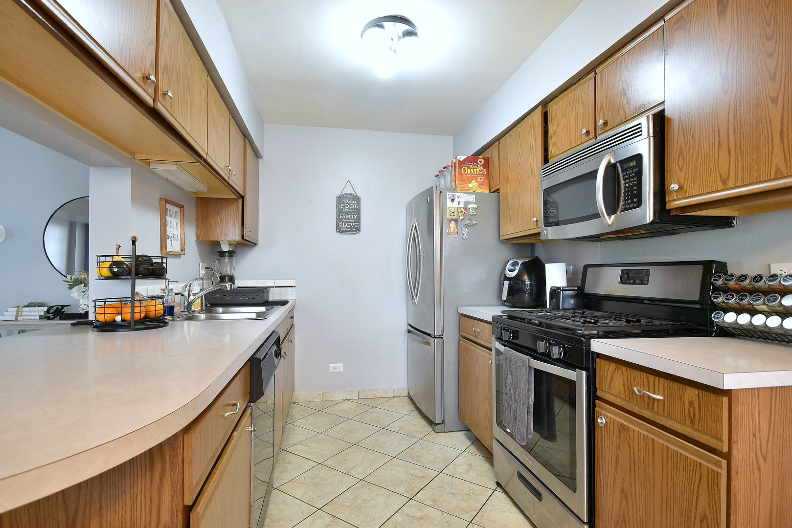 210 Shadybrook Lane Aurora, IL 60504 - Photo 8 of 26 a kitchen with stainless steel appliances granite countertop a stove a sink dishwasher and a refrigerator