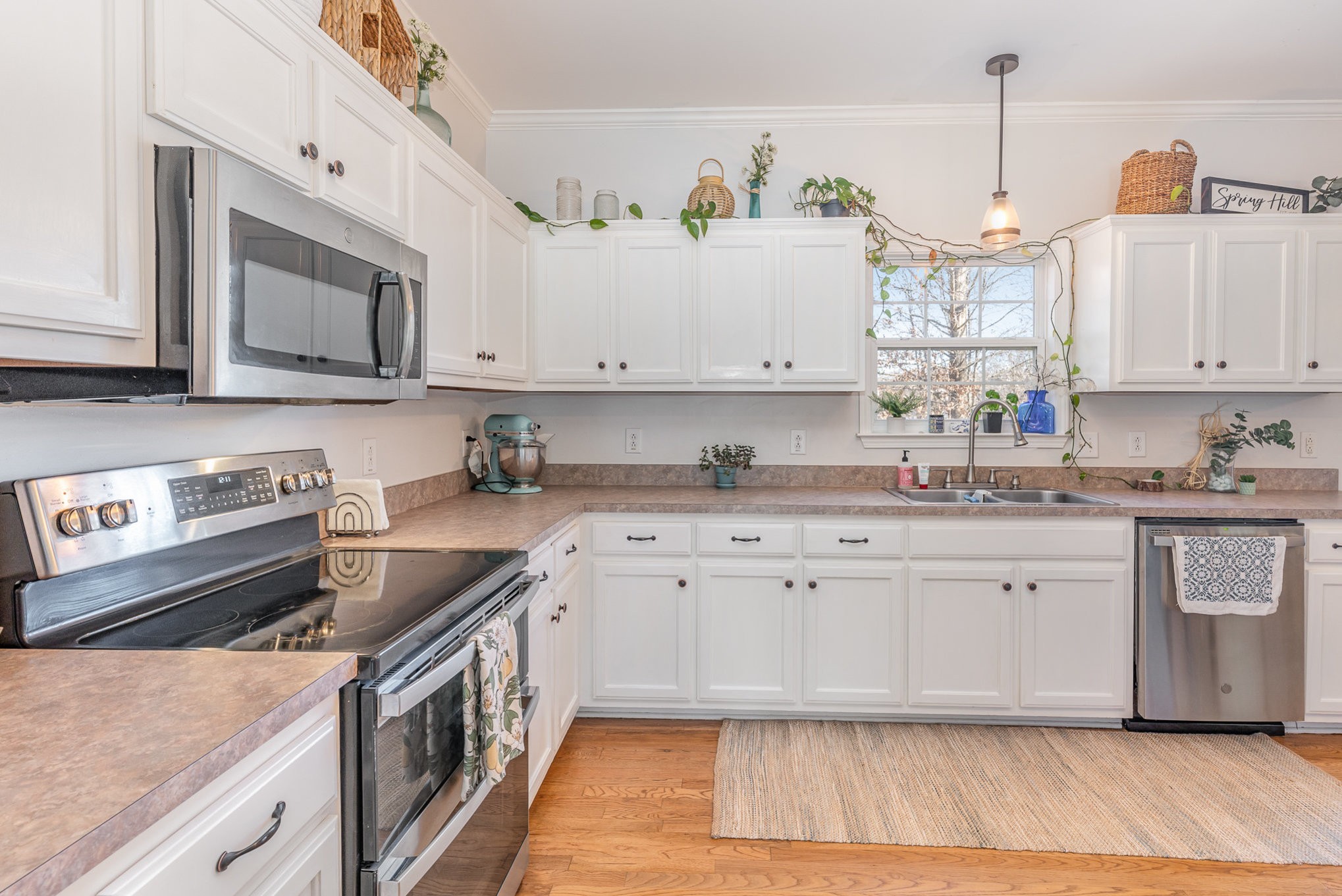 3053 Romain Trail Spring Hill, TN 37174 - Photo 11 of 32 a kitchen with granite countertop cabinets stainless steel appliances and a sink
