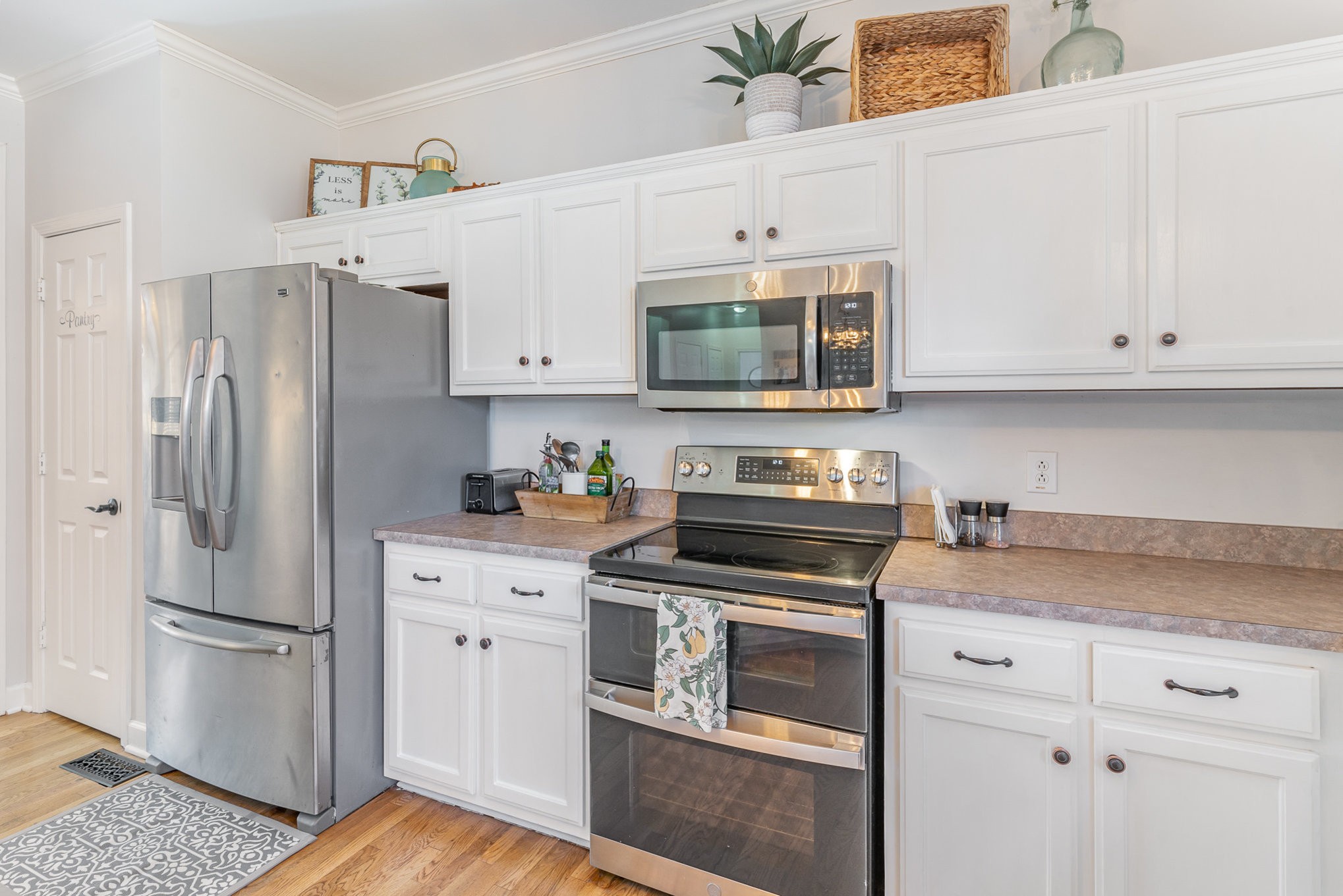3053 Romain Trail Spring Hill, TN 37174 - Photo 13 of 32 a kitchen with cabinets stainless steel appliances and a counter space