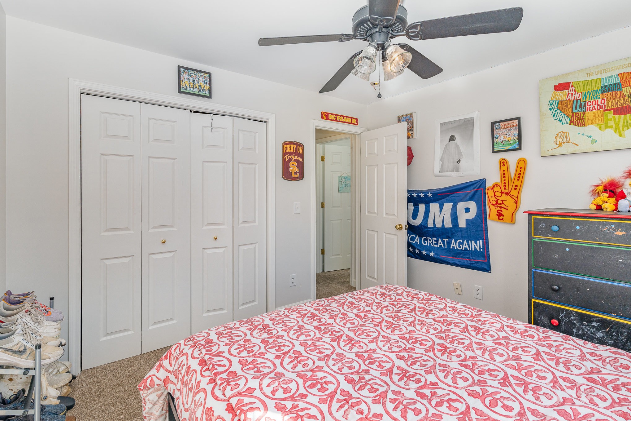 3053 Romain Trail Spring Hill, TN 37174 - Photo 24 of 32 a bedroom with a bed and a chandelier