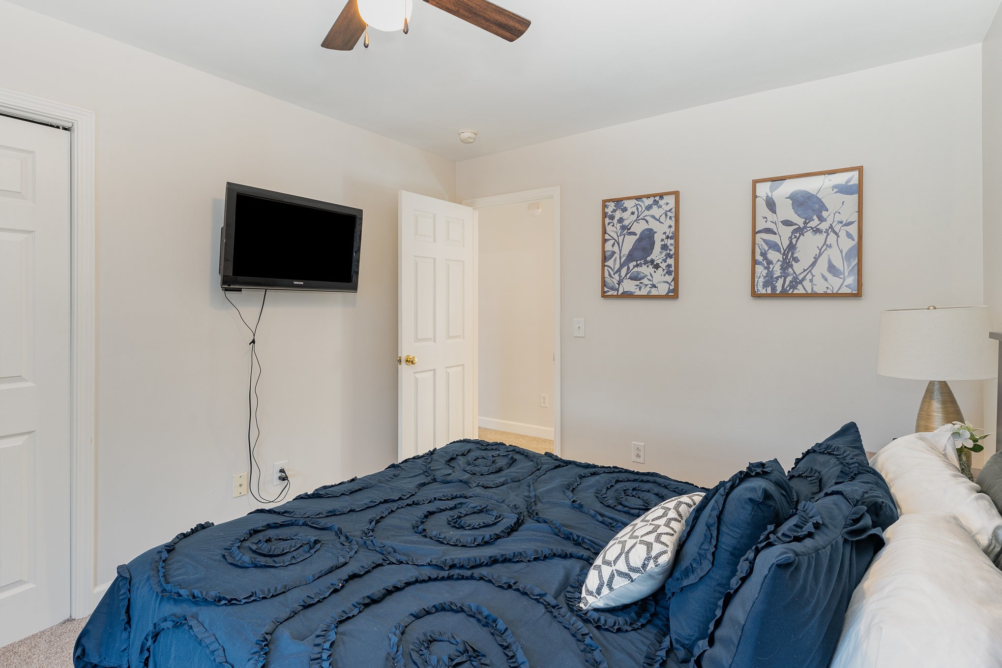 3053 Romain Trail Spring Hill, TN 37174 - Photo 26 of 32 a bedroom with a bed and a flat screen tv