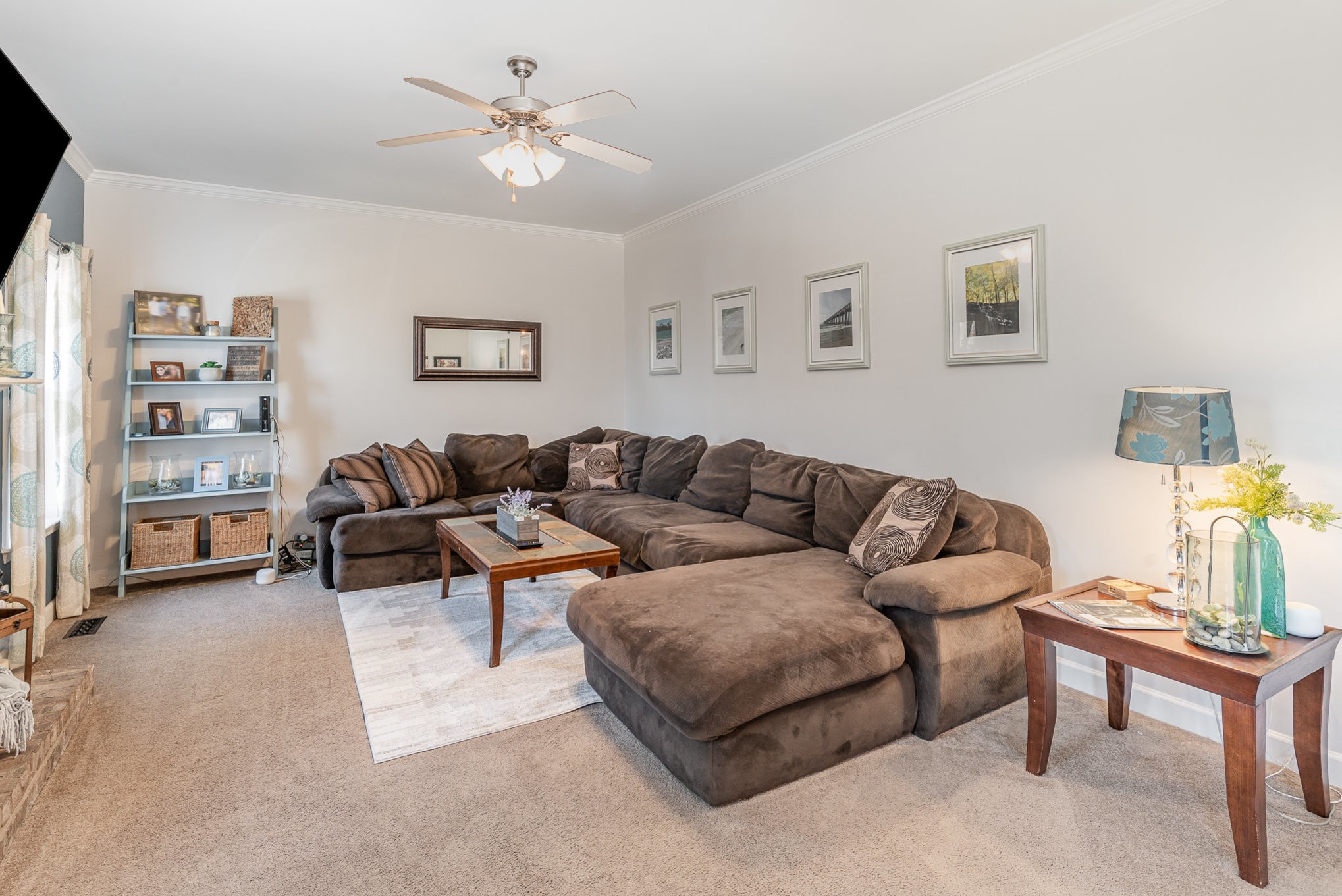 3053 Romain Trail Spring Hill, TN 37174 - Photo 6 of 32 a living room with furniture a lamp paintings and a window