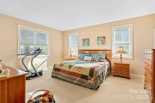 a bedroom with a bed and a table in it