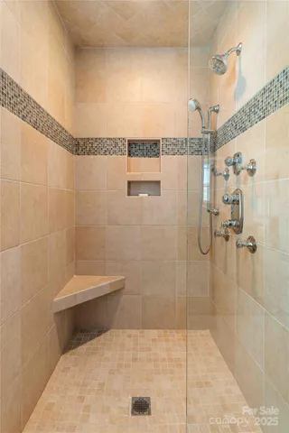 a bathroom with a toilet and shower