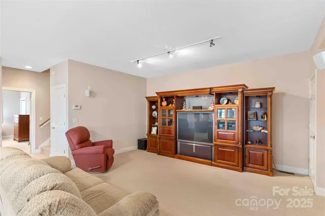 a bedroom with furniture and a rug