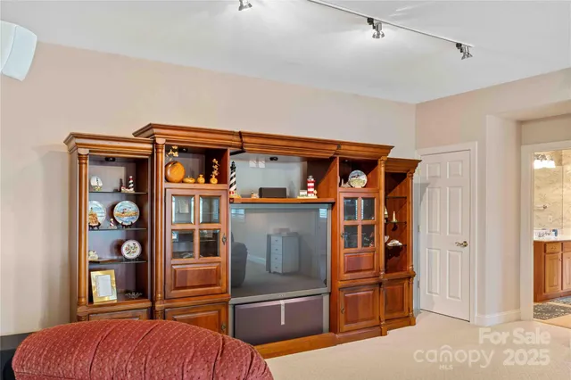 a workspace with furniture and a fan