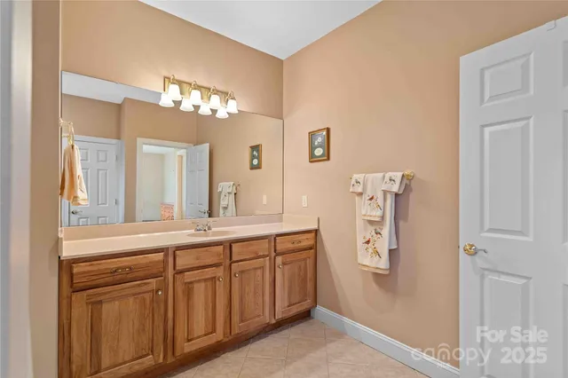 a bathroom with a shower and a sink