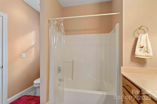 a view of a two chairs in the balcony