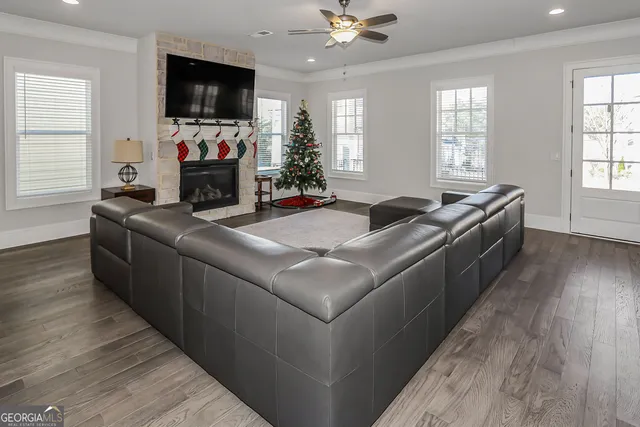 a living room with furniture and a flat screen tv